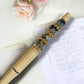 Handmade luxury pen in Canada| Handmade fancy pen made in Canada |Beaded Pens | Handmade Pen | Peach | Rhinestone | Silicone Beaded | Teacher Gift Idea | Cute Gift | Gift for Her | Mom | Colors in peach white gold and rose gold | retractable pen| gold plastic pen | black ink